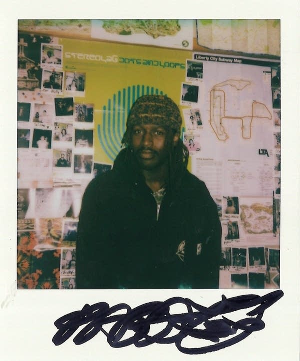 a signed polaroid with a man in it