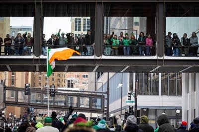 People watch a parade
