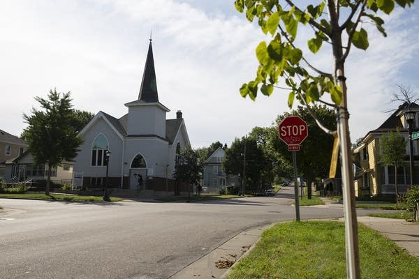 A church at the intersection of a street.