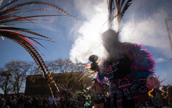 A dancer with an Aztec dance group