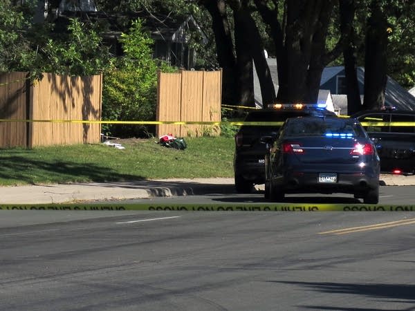 Police tape surrounds a scene near County Road H2 and Pinewood Court