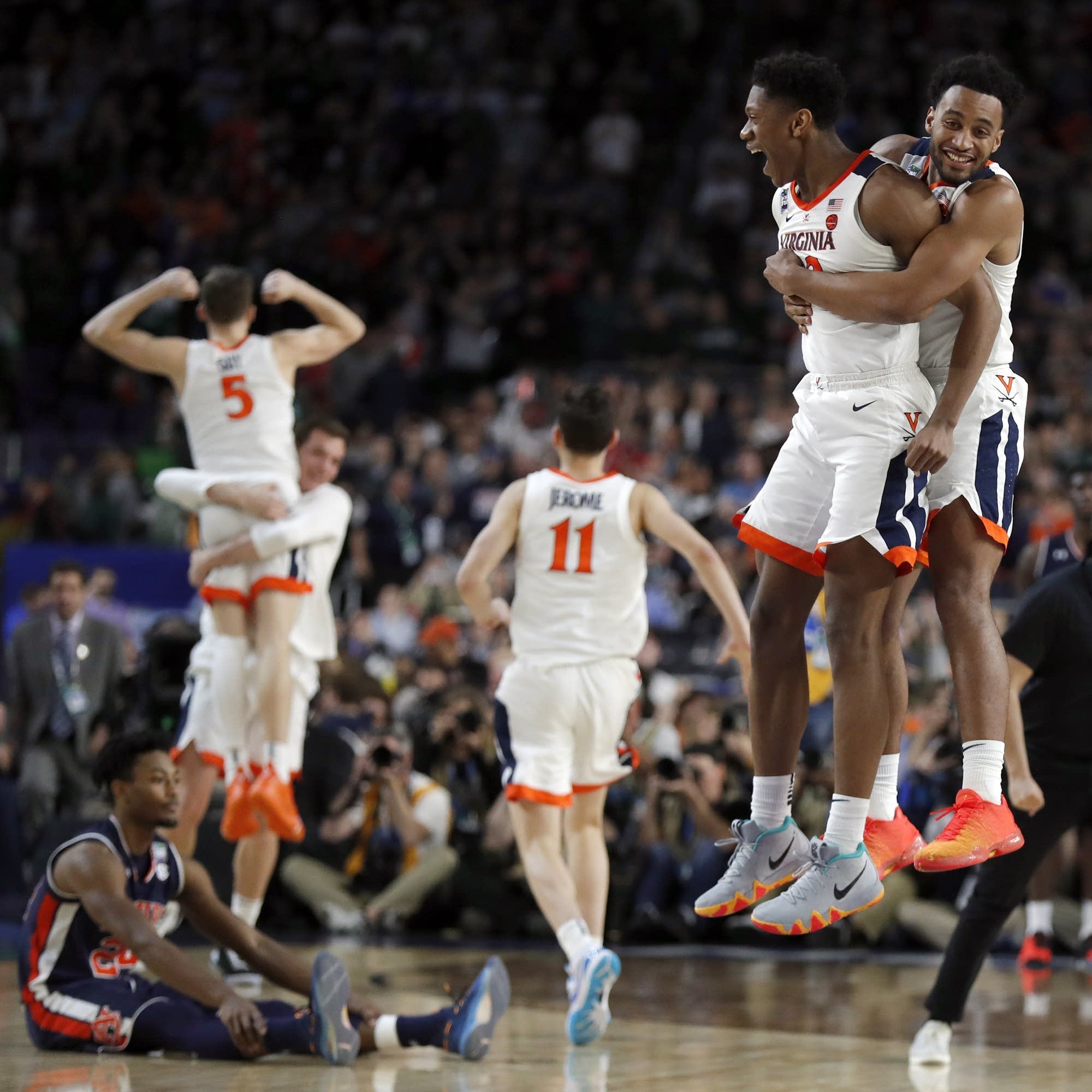 Virginia players celebrate after defeating Auburn