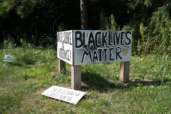 A Black Lives Matter on the side of the road.