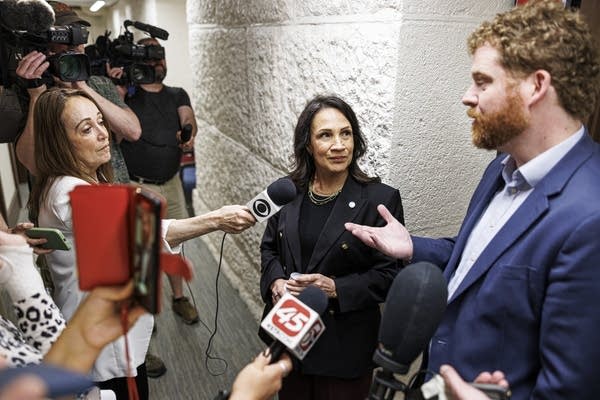 Speaker of the Minnesota House Lisa Demuth, center, and Zack Stephenson,
