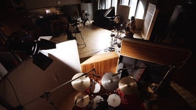 A band performing in a recording studio