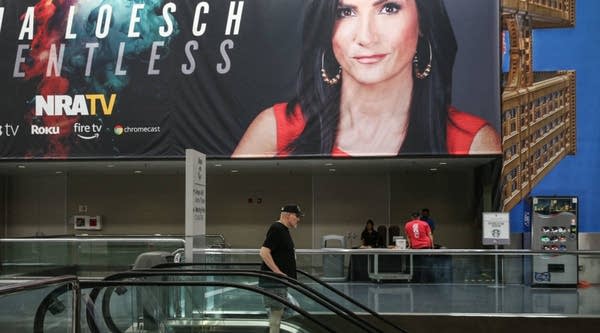 A photo of National Rife Association spokesperson Dana Loesch decorates a wall at the Kay Bailey Hutchison Convention Center during the NRA's annual convention May 6, 2018 in Dallas, Texas.