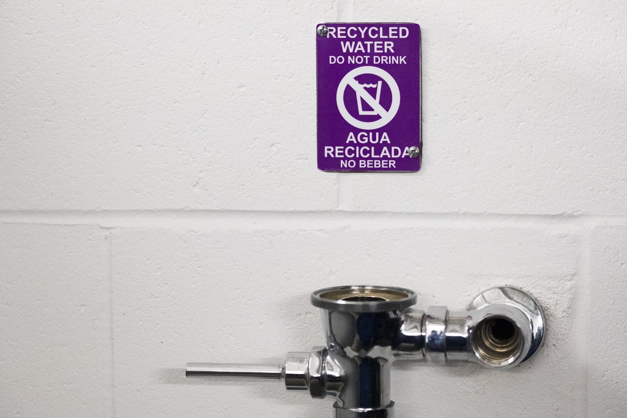 Signs warn fans not to drink from urinals