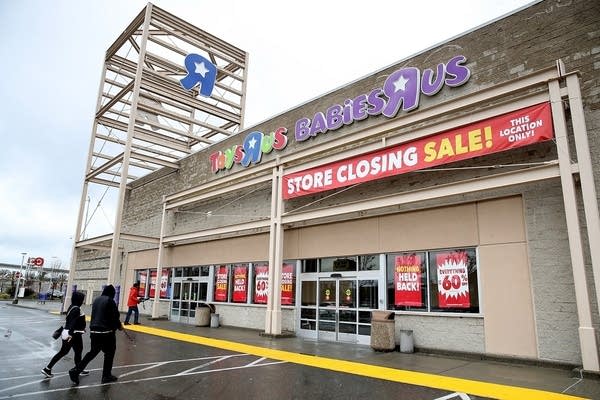 Customers enter a Toys R Us store on March 15, 2018, in Emeryville, California.