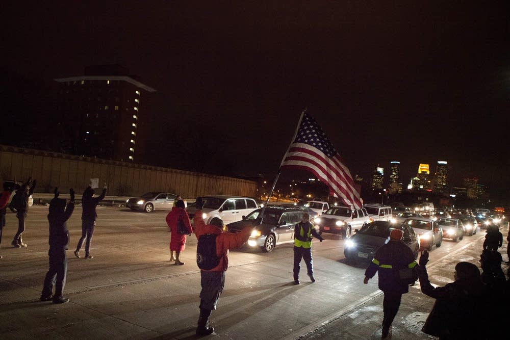 Protesters march down Hiawatha Avenue