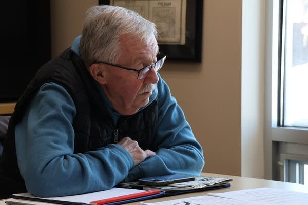 man sitting at table