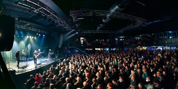 Frank Black and band performing on stage
