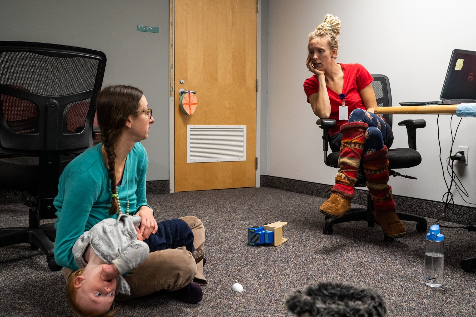 Nurse Amy Schmidt with Amanda Weberg and her 1-year-old son Odin