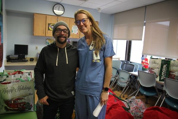 Two people posing for pic at hospital