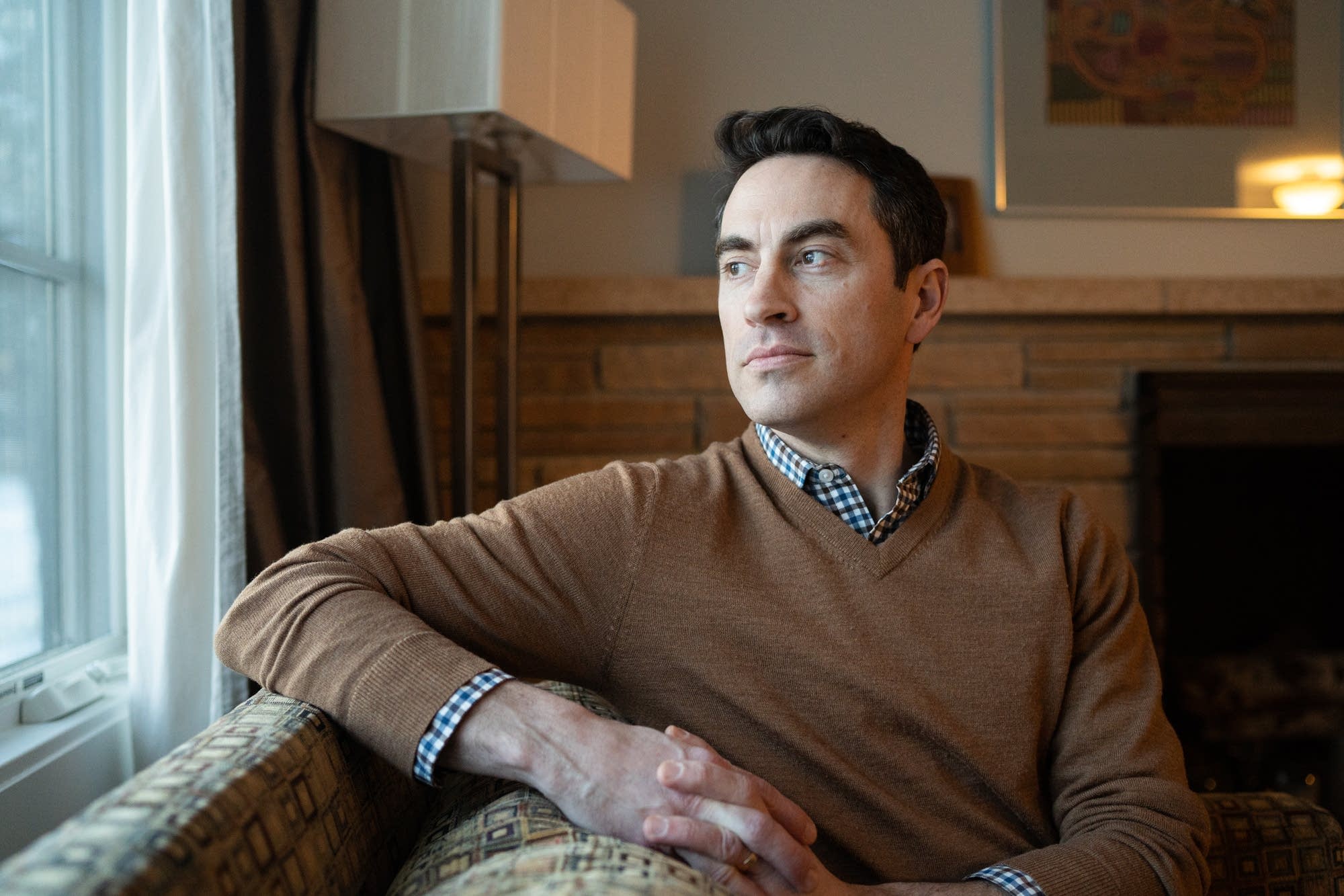 Chip LaCasse sits for a portrait inside of his family's Edina, Minn., home