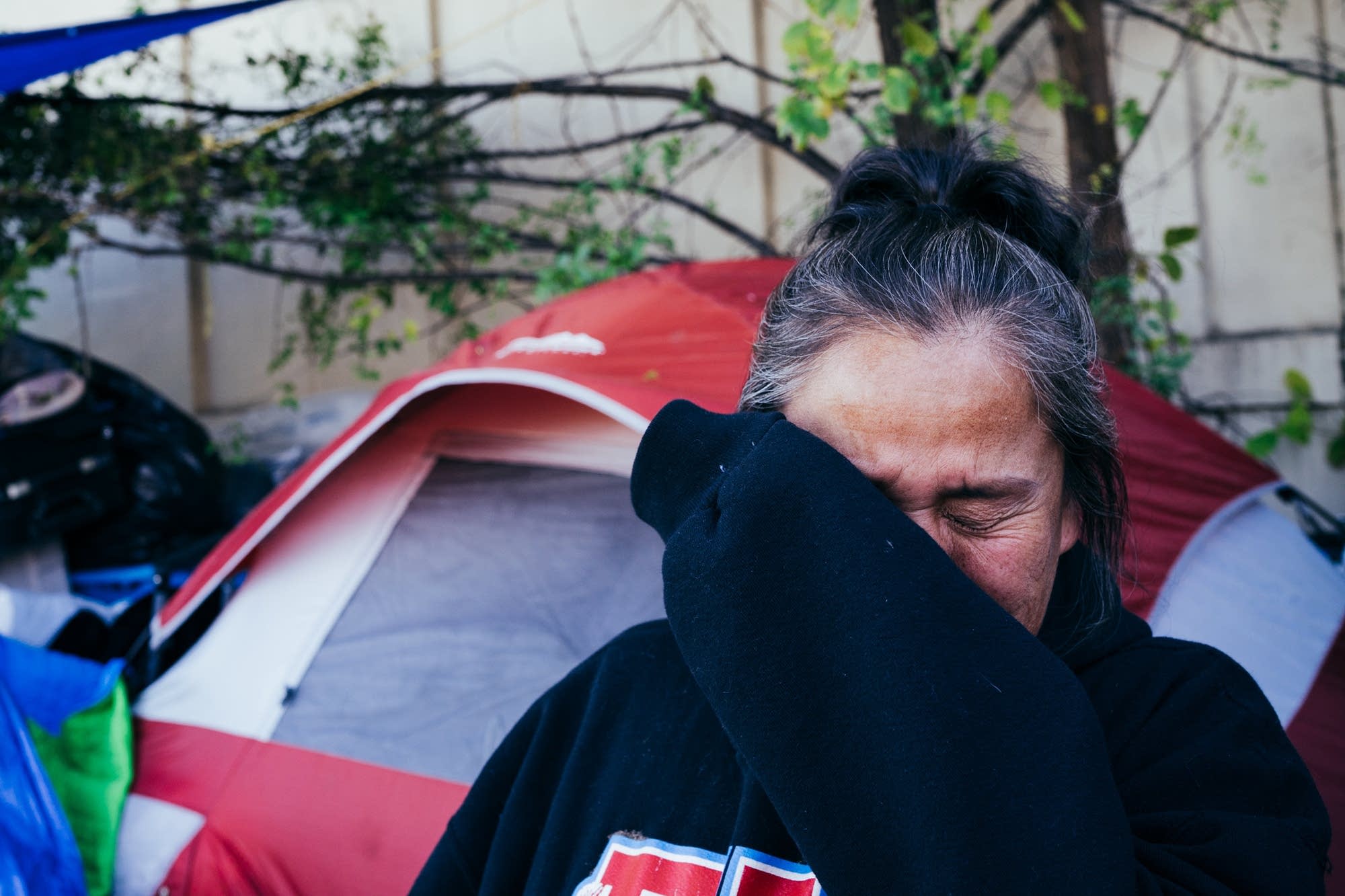 Maggie Thunder Hawk tears up as she talks about finding housing.