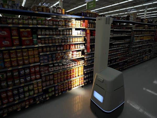 A Bossa Nova robot scans shelves at a Walmart