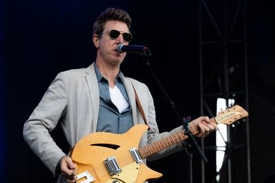 hamilton leithauser and his band performing on stage
