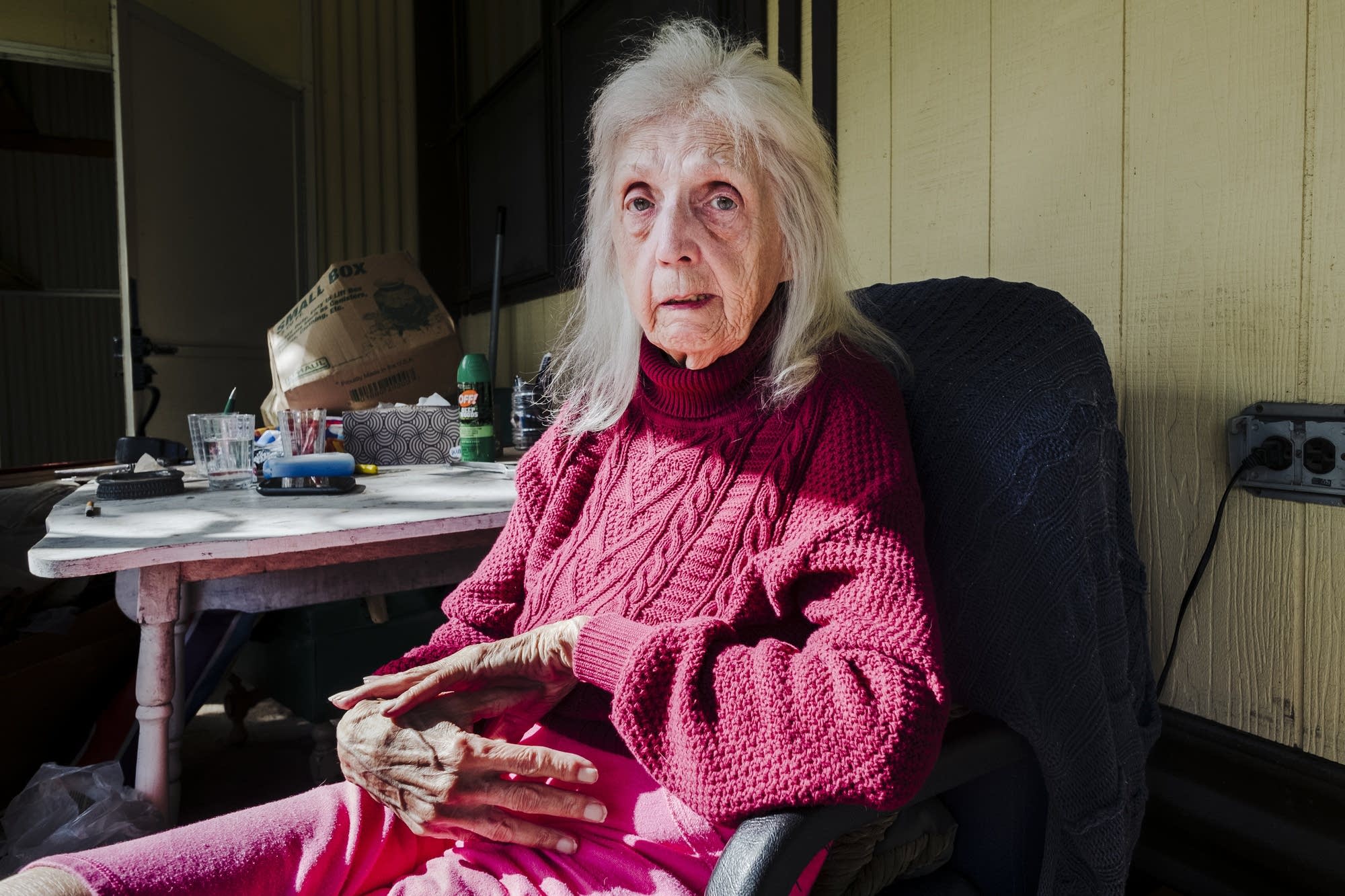Jean Christianson sits on her patio.