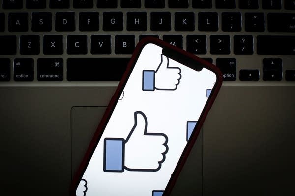 The Facebook like logo is seen on a portable mobile device (Photo by Jaap Arriens/NurPhoto via Getty Images)