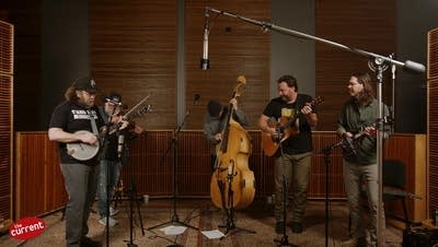 A band performing in a recording studio