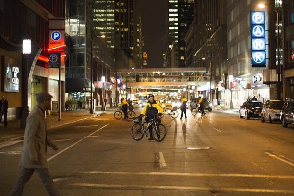 Police officers block a street.