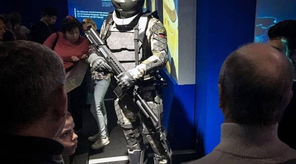 Visitors look at a prototype of a high-tech combat suit for the Russian army during an exhibition entitled "Russia Focused on the Future" at the Manege Hall in downtown Moscow on Nov. 6.