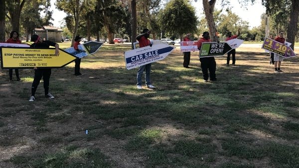 Aarow sign spinners at a training session in North Hollywood Park in California.