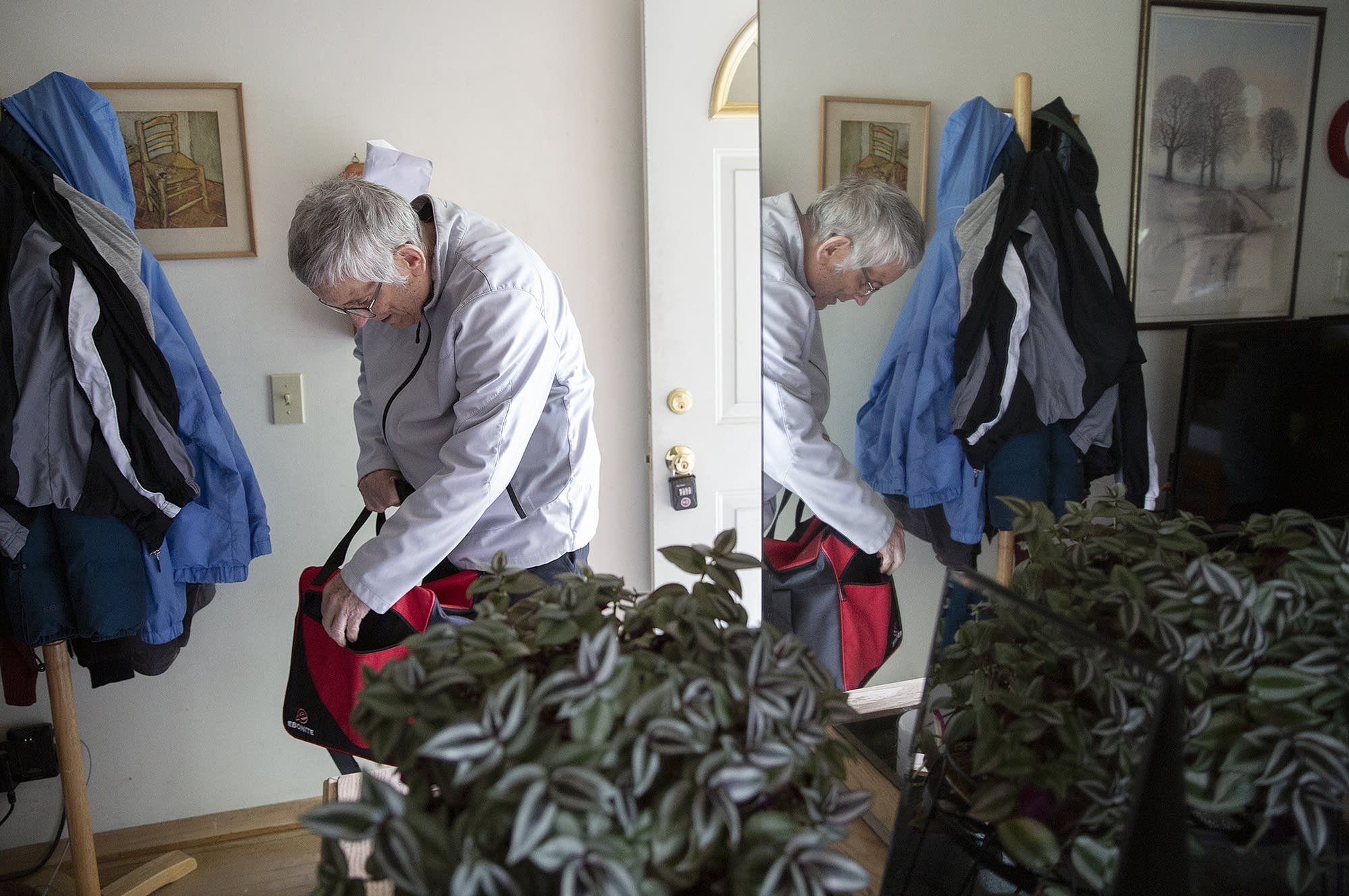 Garry Nims checks his bowling bag at his home.