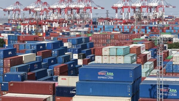 Shipping containers await ships at the Shanghai Port container terminal.