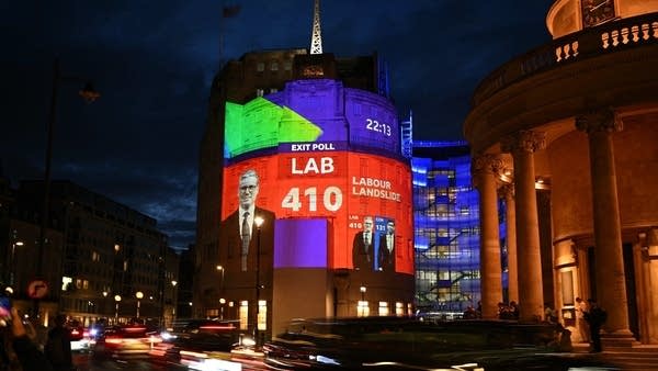 Exit poll results predicting a Labour Party victory are projected onto the BBC's headquarters in London.