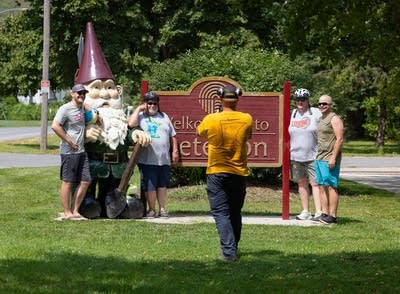 Peterson city worker Jeff Rein takes a break from mowing to take a photo
