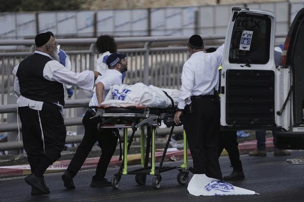 Palestinian gunmen open fire at Jerusalem bus stop, killing 6, Israeli officials say