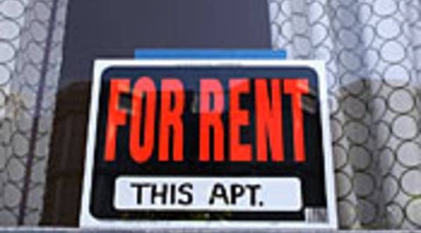 A sign advertising an apartment for rent is displayed in a window in San Francisco.
