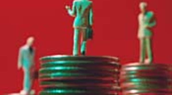 Businessman figures on coin stacks
