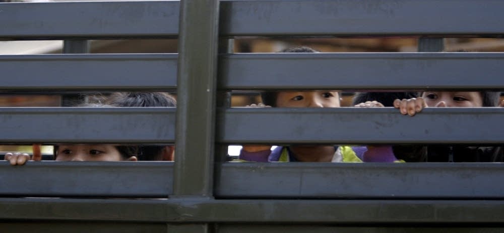 Hmong children leaving Thailand