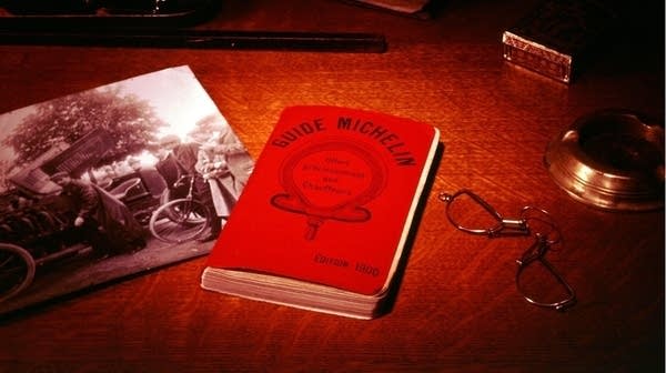 A red book on a table