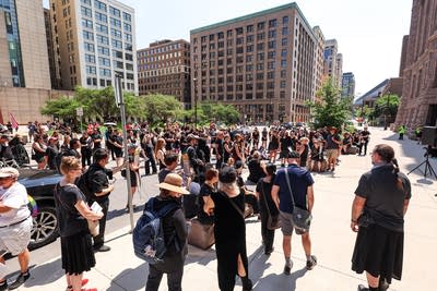 Protesters gather near City Hall and the federal courthouse