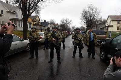 Police officers block a street in north Mpls.