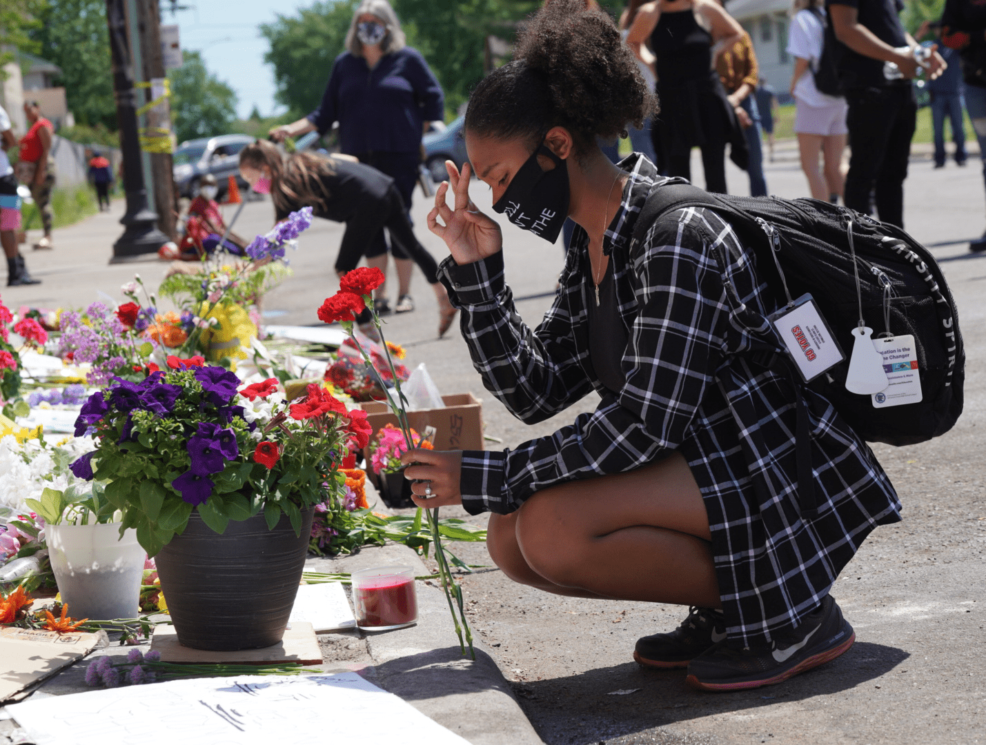 A person kneels to pray. 