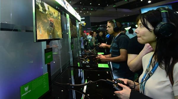Gaming fans sample Predator on Acer during the 2016 Electronic Entertainment Expo (E3) annual video game conference in Los Angeles, California.