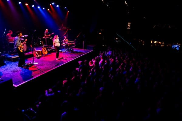 Your Smith and band performing on stage