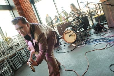 Two musicians performing in a taproom