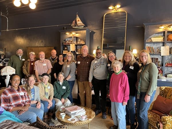 group of people standing and smiling