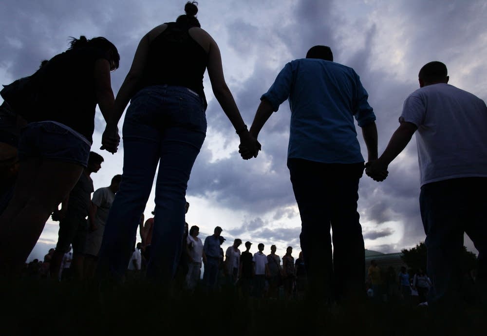 Praying at the memorial service