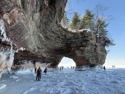 Hikers explore the Apostle Islands ice caves