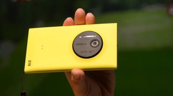 A employee demonstrates the photo capabilities of the Nokia Lumia 1020, a Windows Phone with a 41-megapixel camera after its unveiling in New York City July 11, 2013.