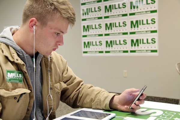 Intern Samuel Krueger makes calls.