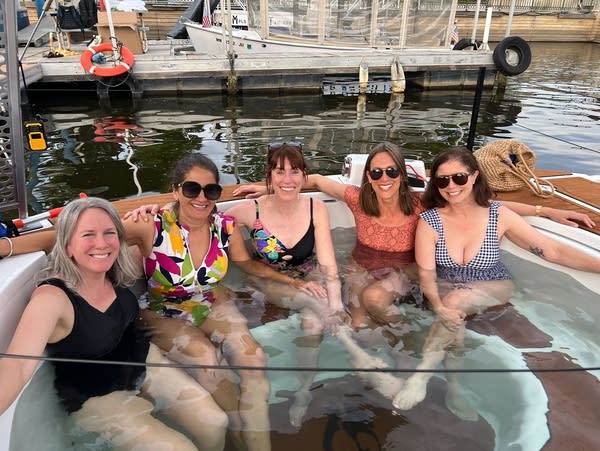 women smile in hot tub