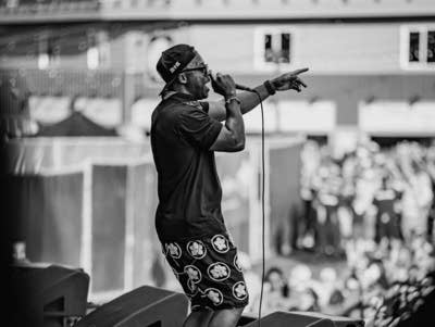 Lupe Fiasco performing on stage