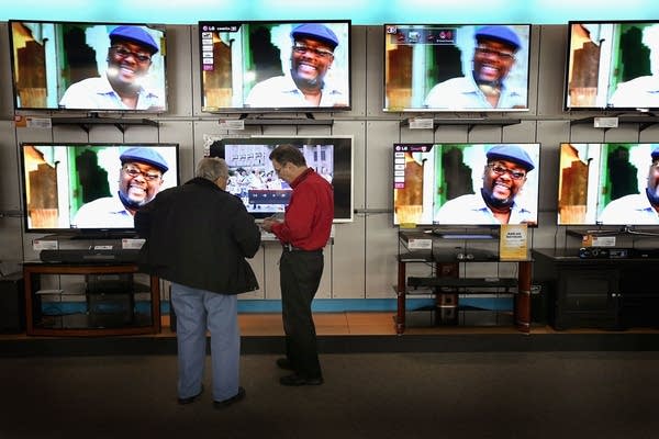 Customer shops for televisions